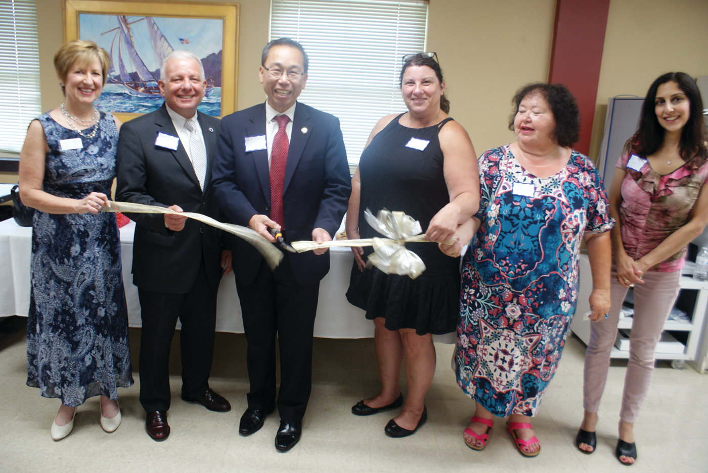 MEMORY CAFÉ: A ribbon-cutting ceremony was held July 12 for the new Memory Café at the Cranston Enrichment Center on Cranston Street. Pictured, from left, are Laurie Mantz of Dementia Training for Life, Senior Services Executive Director Jeffrey Barone, Mayor Allan Fung; Right at Home In-Home Care owner Naomi Cotron and community liaison Maxine Hutchins, and Jennifer Kevorkian, social services director at the Cranston Enrichment Center.